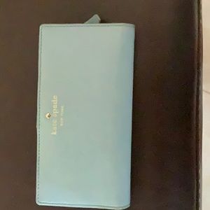 Women’s Kate Spade wallet.
